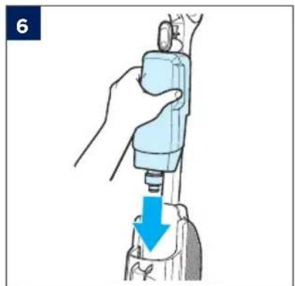 Illustration of a hand using a medical or surgical tool to press down a device, with a blue arrow indicating the process (no text or symbols present)