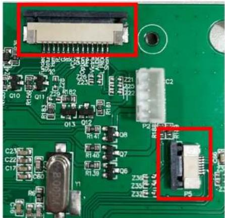 Close-up of a green printed circuit board with various electronic components and connectors (no readable text or symbols)
