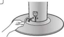 Illustration of a hand inserting a small object into a cylindrical device (no text or symbols)