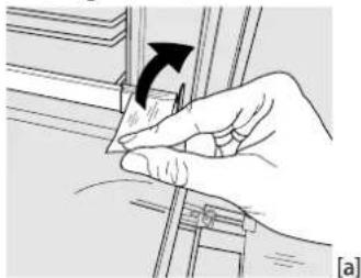 Hand holding a small object with an arrow indicating rotation, no text or symbols present