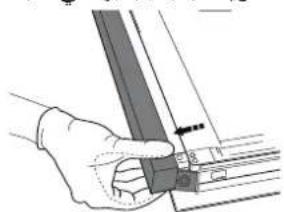 Hand holding a metal bracket with a small inset view showing internal structure (no text or symbols)