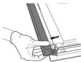 Hand holding a metal bracket with a small inset view showing a pin (no text or symbols visible)