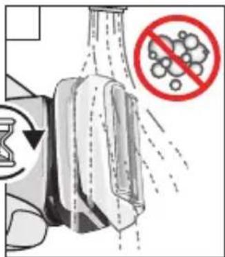 Diagram illustrating a spray bottle with particles and a prohibition symbol, showing fluid flow and particle distribution.