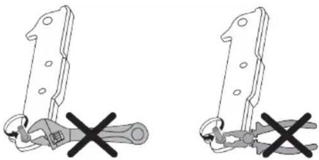 Two identical line drawings of a mechanical clamp or bracket with a cross mark, no text or symbols present.