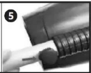 Close-up of a hand holding a cylindrical object with a circular head, possibly a tool or component (no visible text or symbols)