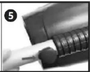 Close-up of a hand holding a cylindrical object with a circular base, next to a mechanical component (no visible text or symbols)