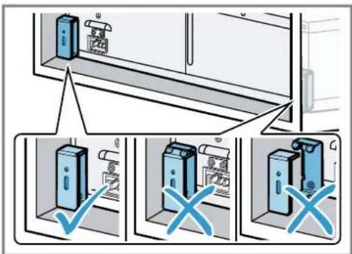 Diagram illustrating three steps of installing or maintaining a wall-mounted device, with checkmark and cross symbols indicating failure or rejection.