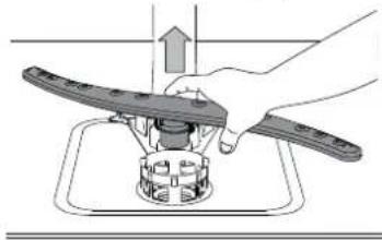 Illustration of a hand using a tool to press or install a mechanical component on a workbench (no text or symbols visible).