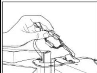 Line drawing of a hand using a tool to adjust or install a component (no text or symbols present)