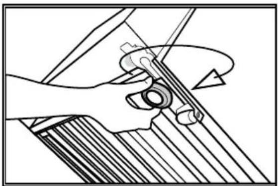 Mechanical diagram showing hands operating a tool with a circular component, no text or symbols present