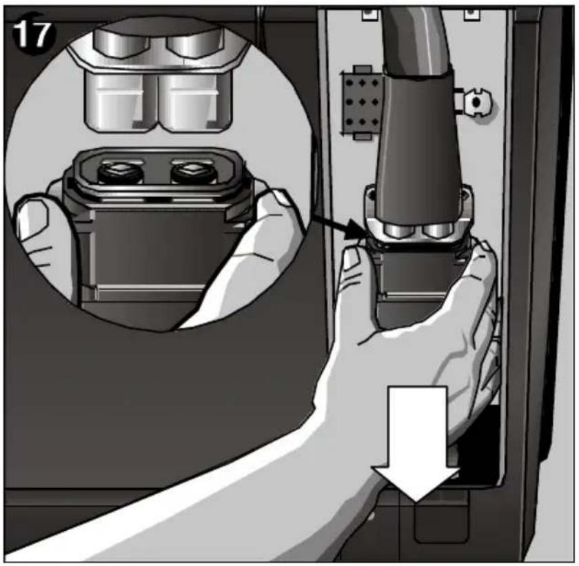 Illustration of a hand inserting a plug into a device panel, showing internal components and a downward arrow (no text or symbols).
