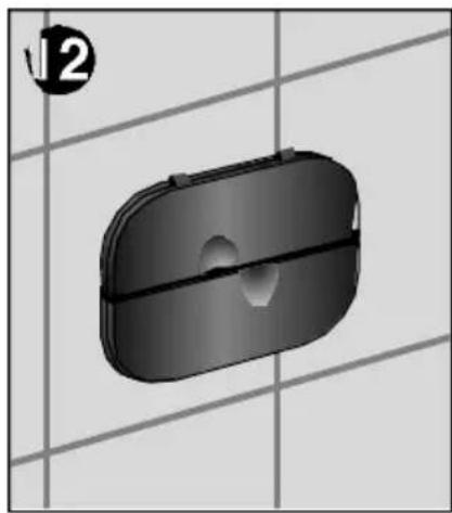 3D rendered object with rounded rectangular body and central hole, set against a grid background (no text or symbols).