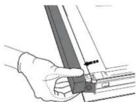 Hand holding a metal bracket with a small inset view (no text or symbols visible)
