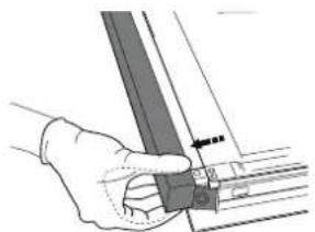 Hand holding a mechanical component with a ruler and guide rod (no visible text or symbols).
