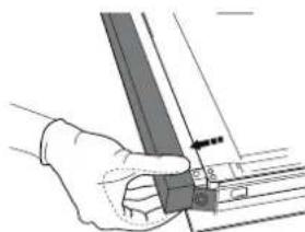 Hand holding a metal bracket with a small inset view showing a pin (no text or symbols visible)