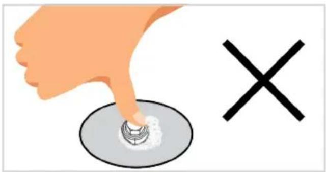 Illustration showing a hand pressing a button on a circular button with a cross symbol, indicating a correct or incorrect action.