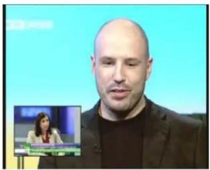 Man speaking on a screen with an inset image of a woman in a microphone, showing text about a presentation or interview.