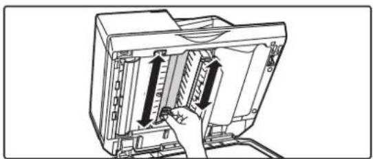 Illustration of a computer monitor with an open panel and a hand inserting a cable.