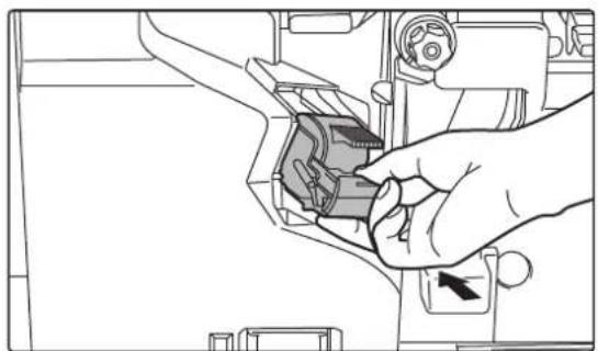 Line drawing of a hand inserting a component into a vehicle's engine compartment.