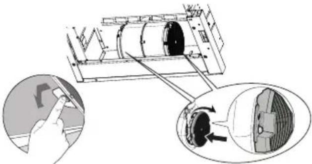 Diagram showing a mechanical assembly with a hand interacting with a device, and a close-up of the component being inserted (no text or symbols present)