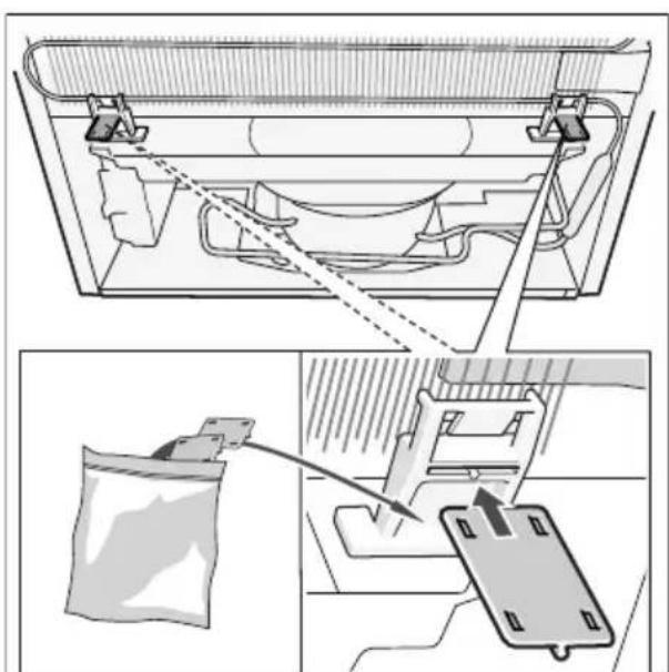 Technical diagram showing a mechanical assembly with a bag and a clamp, no visible text or symbols.