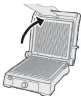 Illustration of a portable grill with a hand pointing to the lid area, no text or symbols.