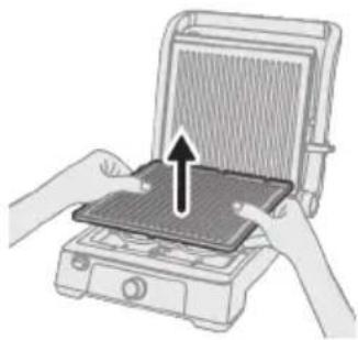 Illustration of hands installing or adjusting a device on a flat panel (no text or symbols visible).