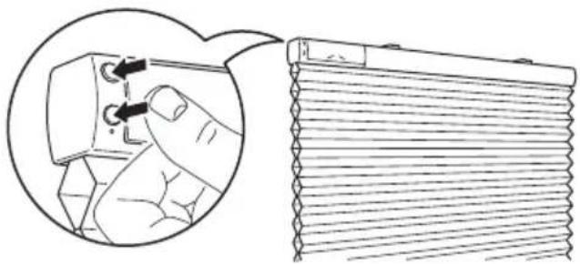 Diagram showing a hand inserting a component into a device, with a magnified view of the device's internal structure (no text or symbols present).