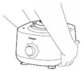Line drawing of hands operating a kitchen appliance (no text or symbols)