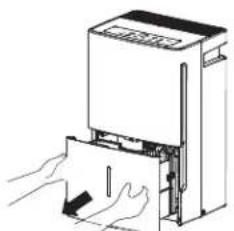 Line drawing of hands inserting a device into a machine (no text or symbols).
