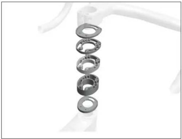 Stacked mechanical components with circular bearings, no visible text or symbols