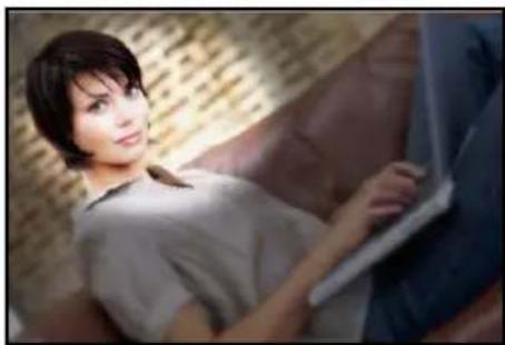 Woman lying on a wooden surface, holding a laptop (no visible text or symbols)