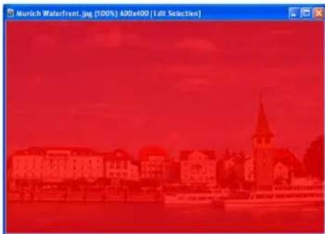 Red-tinted cityscape with a church and waterfront, no visible text or symbols
