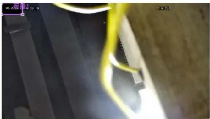 Close-up of a textured surface with yellow and black lines, no visible text or symbols