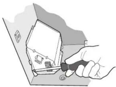 Illustration of a hand using a tool to adjust or install electronic components on a device (no text or symbols visible)