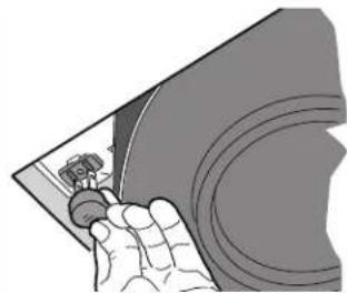 Illustration of a hand holding a small object over a curved surface (no text or symbols)