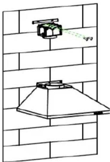 Diagram of a kitchen chimney mounted on a brick wall, with a green spray gun and a butterfly nearby (no text or symbols)