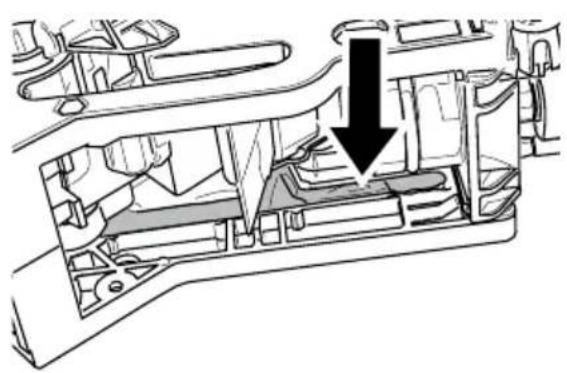 Cross-sectional diagram of a vehicle showing internal components and a downward arrow indicating flow or movement (no text or symbols present)
