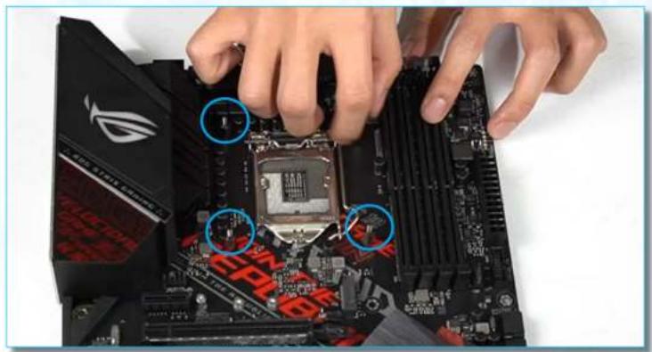 Close-up of hands assembling a computer motherboard with highlighted CPU socket (no text or symbols visible)