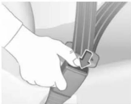 Close-up of a hand adjusting a car seatbelt buckle (no text or symbols visible)