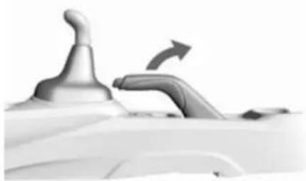 Close-up of a white object with a metallic knob and a curved handle, possibly a device or tool (no visible text or symbols)