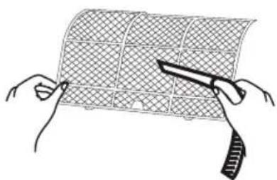 Illustration of two hands holding a grid-patterned sheet with a knife, no text or symbols present