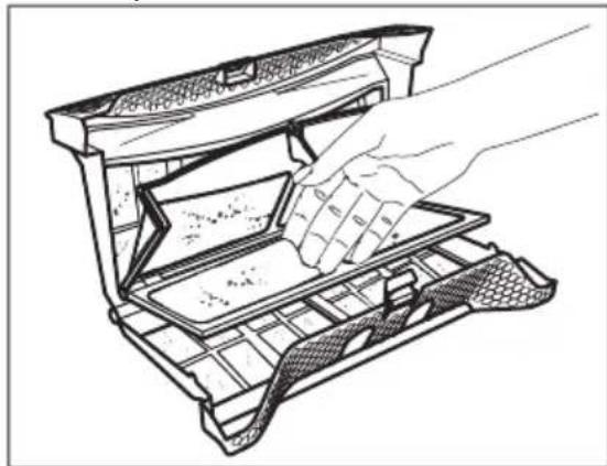 Line drawing of a hand inserting a plastic item into a tray-like device (no text or symbols)