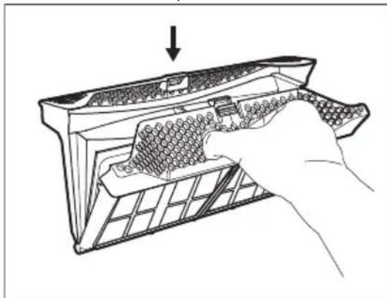 Line drawing of a hand inserting into a device into a grid-patterned panel (no text or symbols).