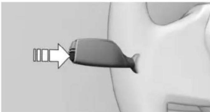 Close-up of a car seatbelt with a white arrow pointing to the handle (no text or symbols visible)