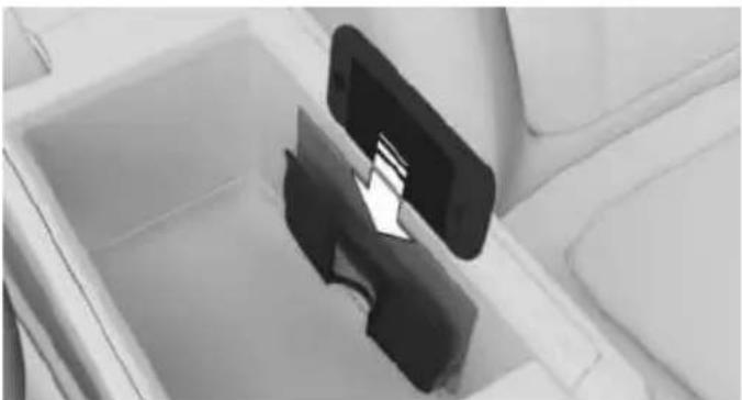 Interior view of a car seatbelt with a black plastic clip inserted into the seat (no visible text or symbols)