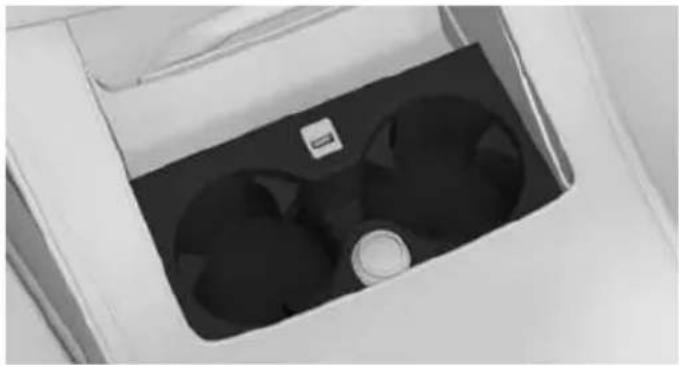 Close-up of a white industrial fan or vent with two black blades, no visible text or symbols