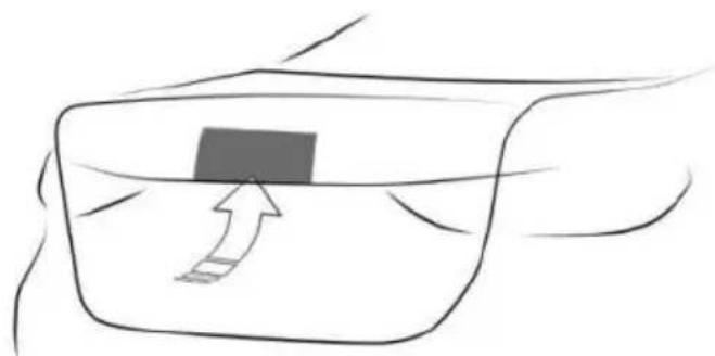 Simple line drawing of a hand holding a rectangular object with an arrow pointing upward (no text or symbols)