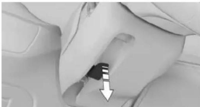 Close-up of a mechanical component with a downward arrow indicating a feature (no text or symbols visible)
