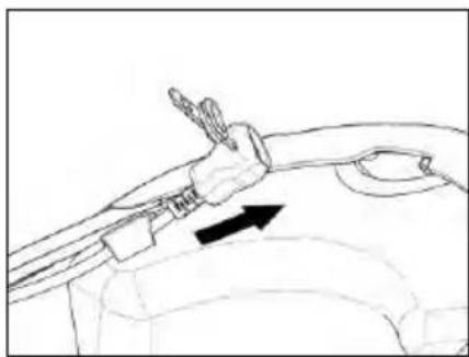 Line drawing of a car interior showing a hand holding a tool near the dashboard (no text or symbols)